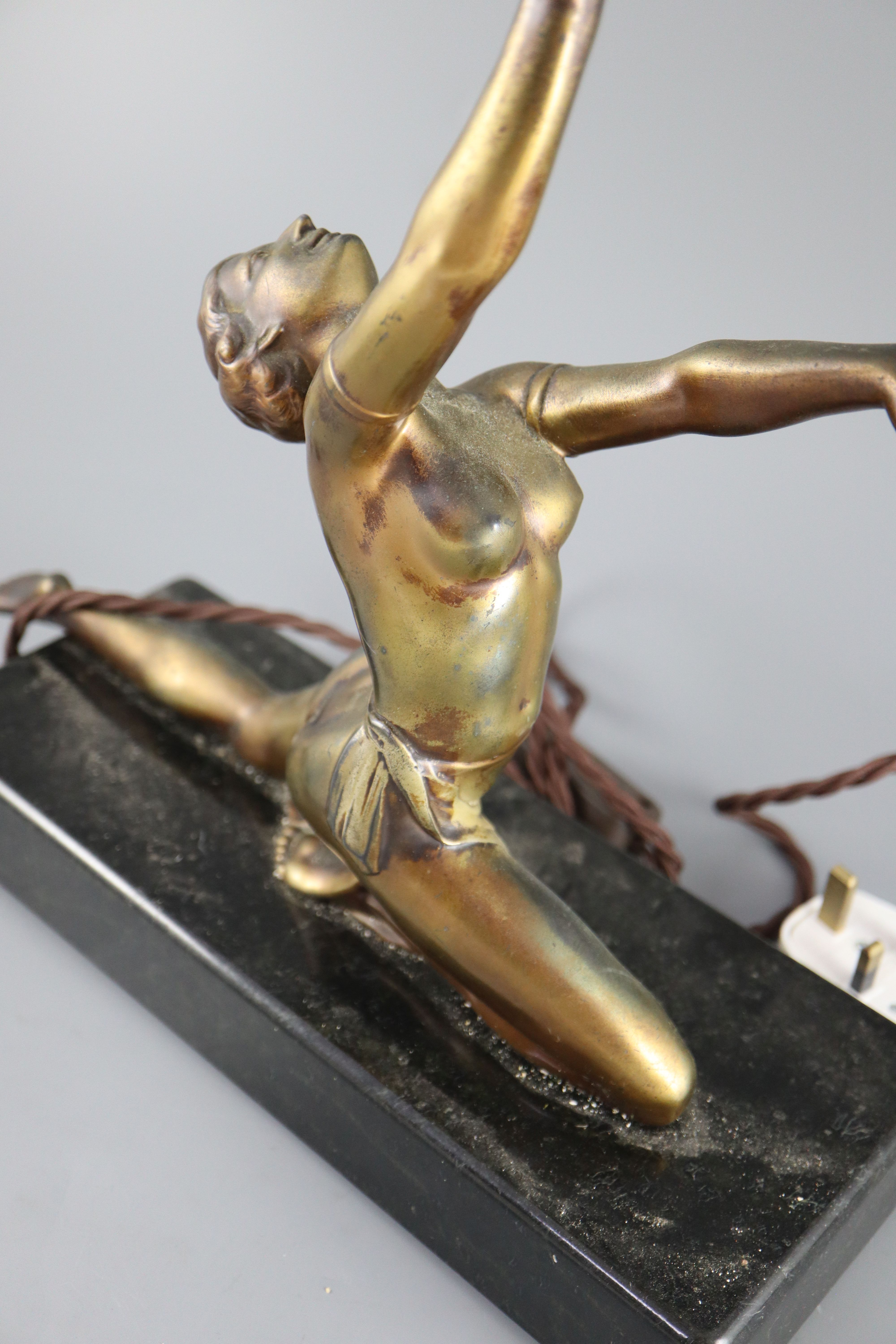 A French Art Deco bronzed spelter table lamp, height 21in.